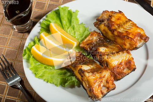 Image of fried catfish. delicious fatty fish on a plate