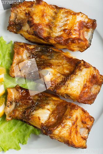 Image of fried catfish. delicious fatty fish on a plate