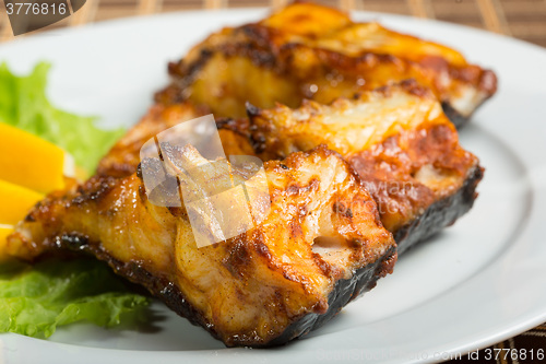 Image of fried catfish. delicious fatty fish on a plate