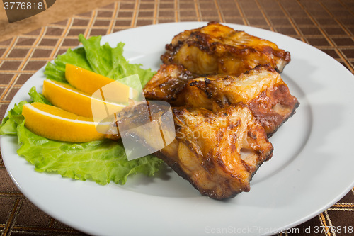 Image of fried catfish. delicious fatty fish on a plate