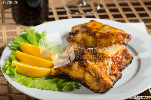 Image of fried catfish. delicious fatty fish on a plate