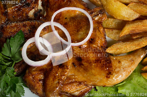 Image of Tobacco chickens with fried potatoes. 