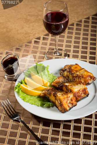 Image of fried catfish. delicious fatty fish on a plate