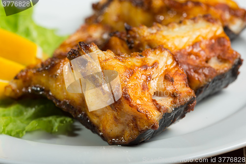 Image of fried catfish. delicious fatty fish on a plate