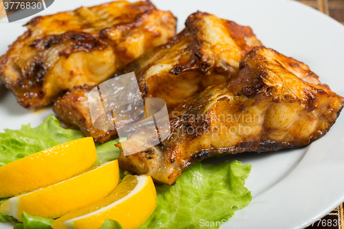 Image of fried catfish. delicious fatty fish on a plate