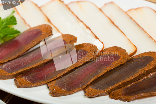 Image of Cutted meat and lard on a plate