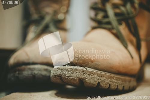 Image of Old and Dirty boots in mud