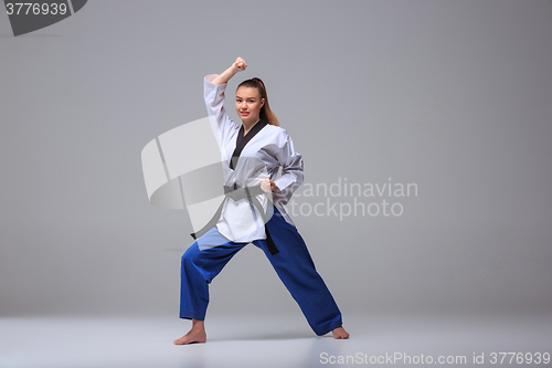 Image of The karate girl with black belt 