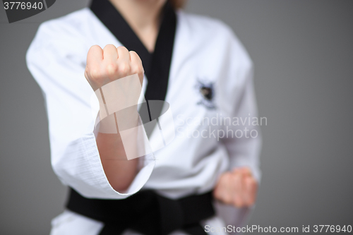 Image of The karate girl with black belt 