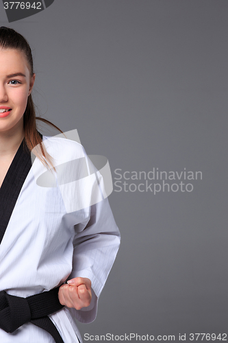 Image of The karate girl with black belt 