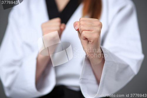 Image of The karate girl with black belt 