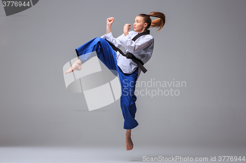 Image of The karate girl with black belt 