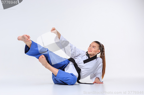 Image of The karate girl with black belt 