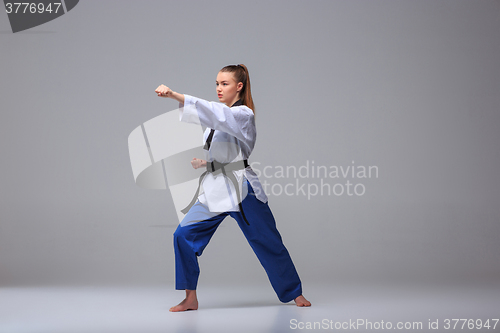 Image of The karate girl with black belt 