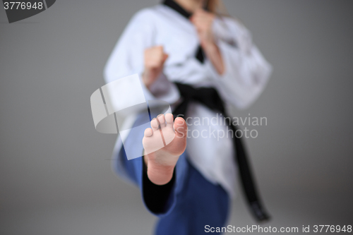 Image of The karate girl with black belt 