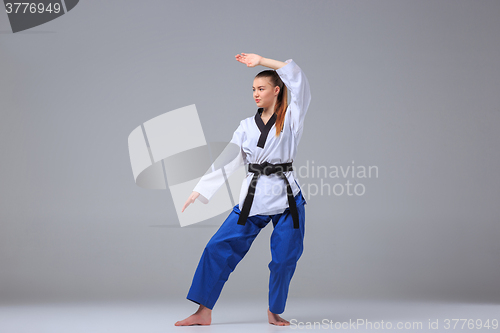 Image of The karate girl with black belt 