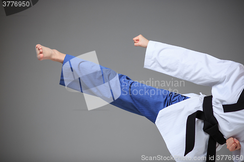 Image of The karate girl with black belt 