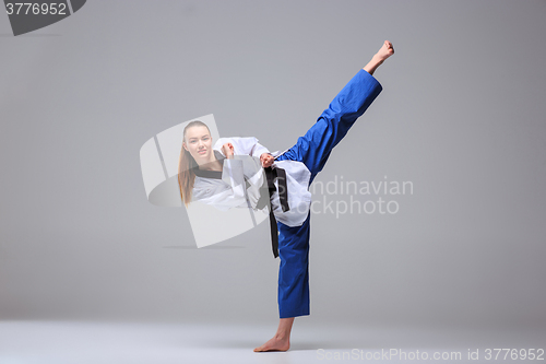 Image of The karate girl with black belt 