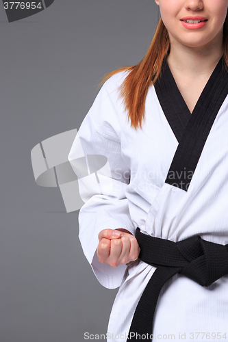 Image of The karate girl with black belt 