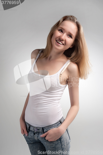 Image of Young woman smiling at camera, portrait