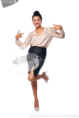 Image of Business woman in full length pointing at herself