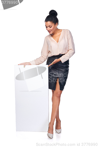 Image of Smiling businesswoman with banner