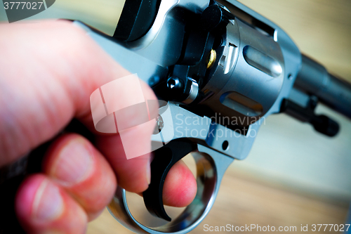 Image of hand with gun