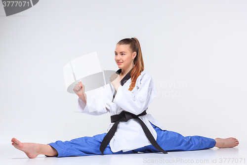 Image of The karate girl with black belt 