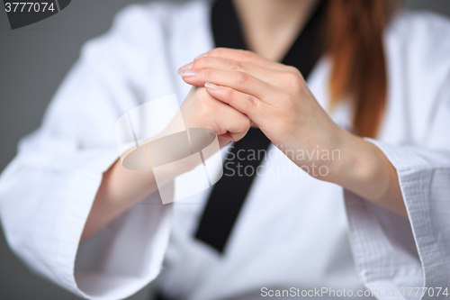 Image of The karate girl with black belt 