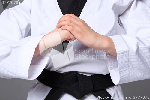 Image of The karate girl with black belt 