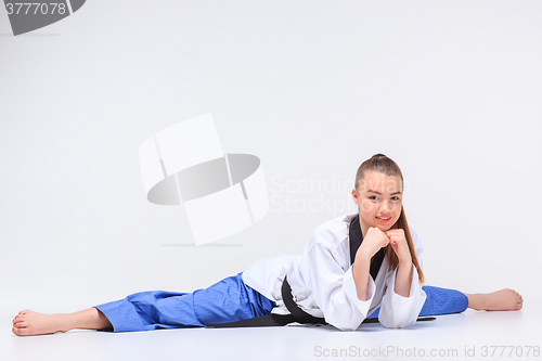 Image of The karate girl with black belt 