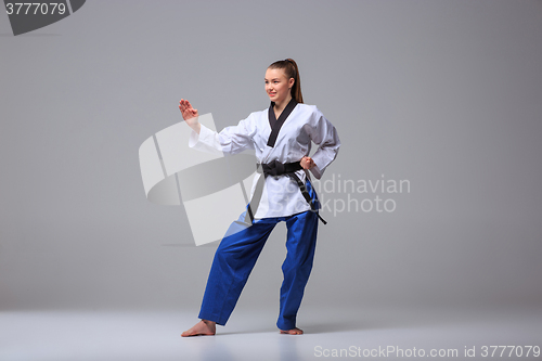 Image of The karate girl with black belt 