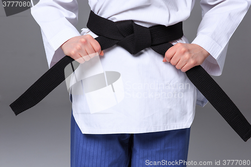 Image of The karate girl with black belt 