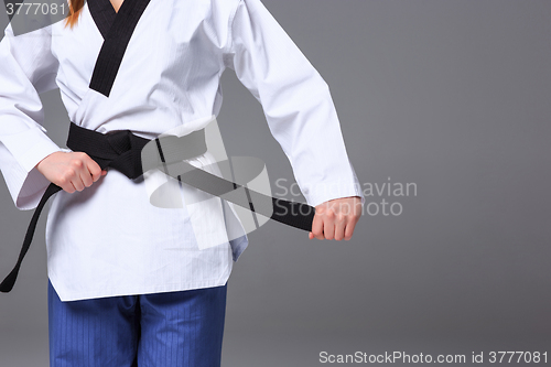 Image of The karate girl with black belt 