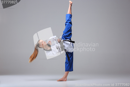 Image of The karate girl with black belt 