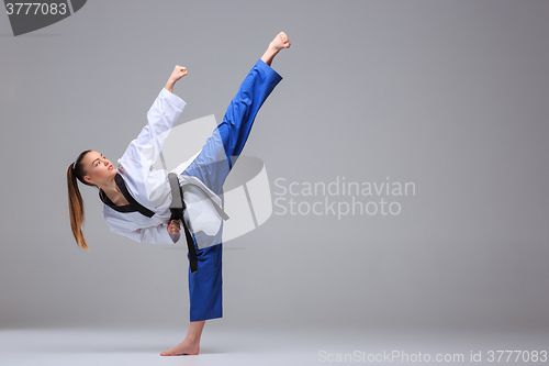 Image of The karate girl with black belt 