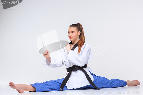 Image of The karate girl with black belt 