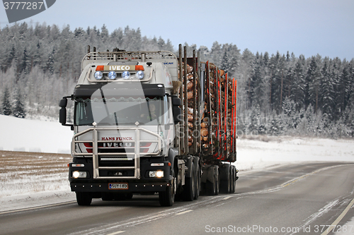 Image of Iveco Trakker 500 Logging Truck Hauls Timber in Winter