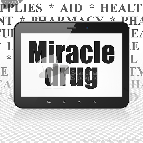 Image of Health concept: Tablet Computer with Miracle Drug on display