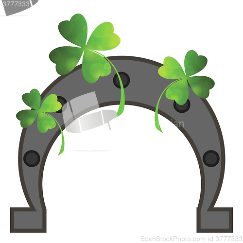 Image of Green Clover Leaves and Horseshoe