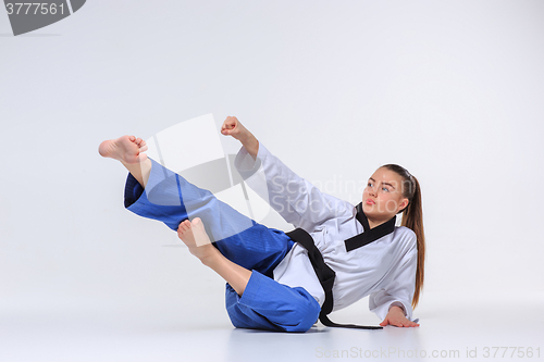 Image of The karate girl with black belt 