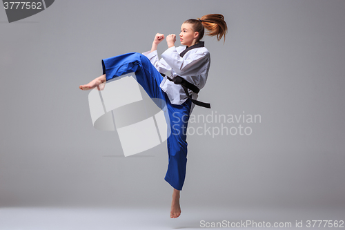 Image of The karate girl with black belt 