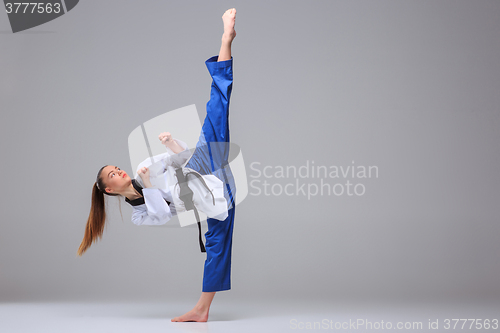 Image of The karate girl with black belt 