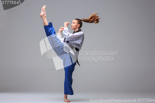 Image of The karate girl with black belt 