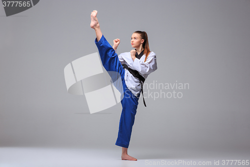 Image of The karate girl with black belt 