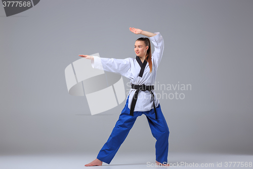 Image of The karate girl with black belt 