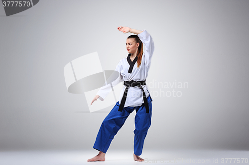 Image of The karate girl with black belt 