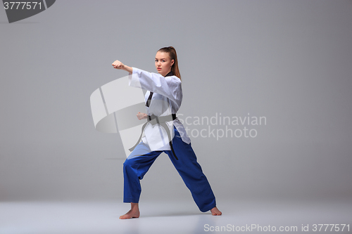 Image of The karate girl with black belt 