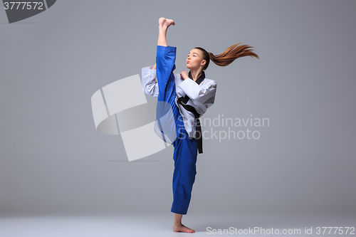 Image of The karate girl with black belt 