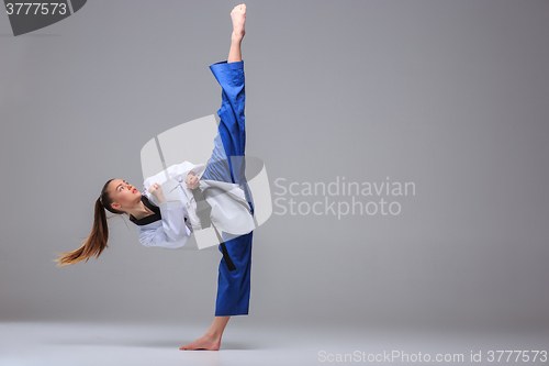 Image of The karate girl with black belt 